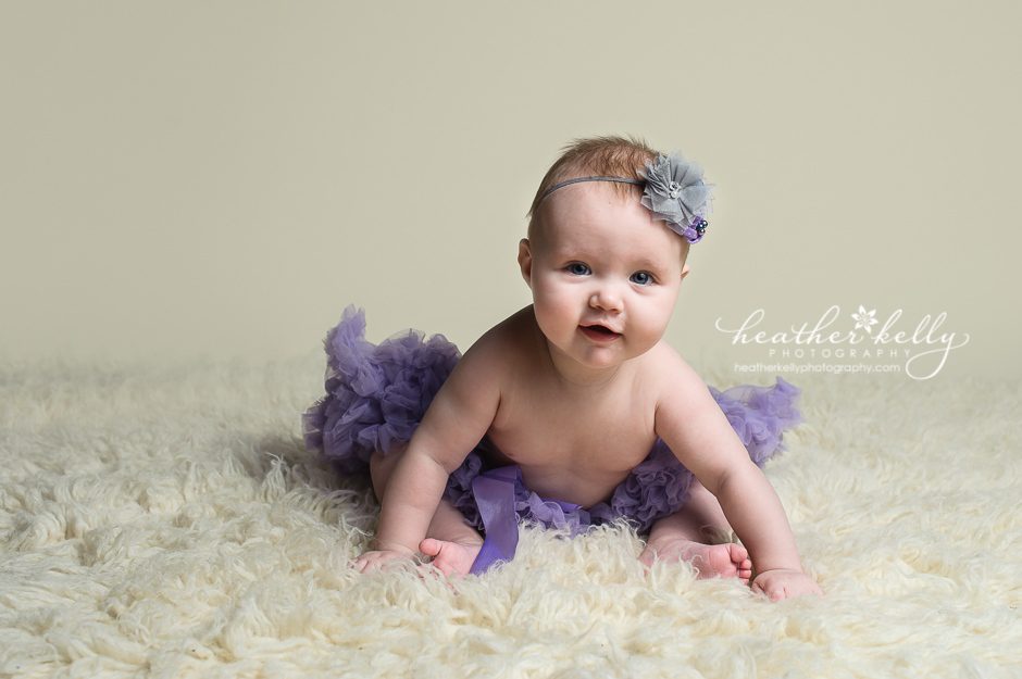 6 month old baby sitting at baby portrait session in Monroe, CT