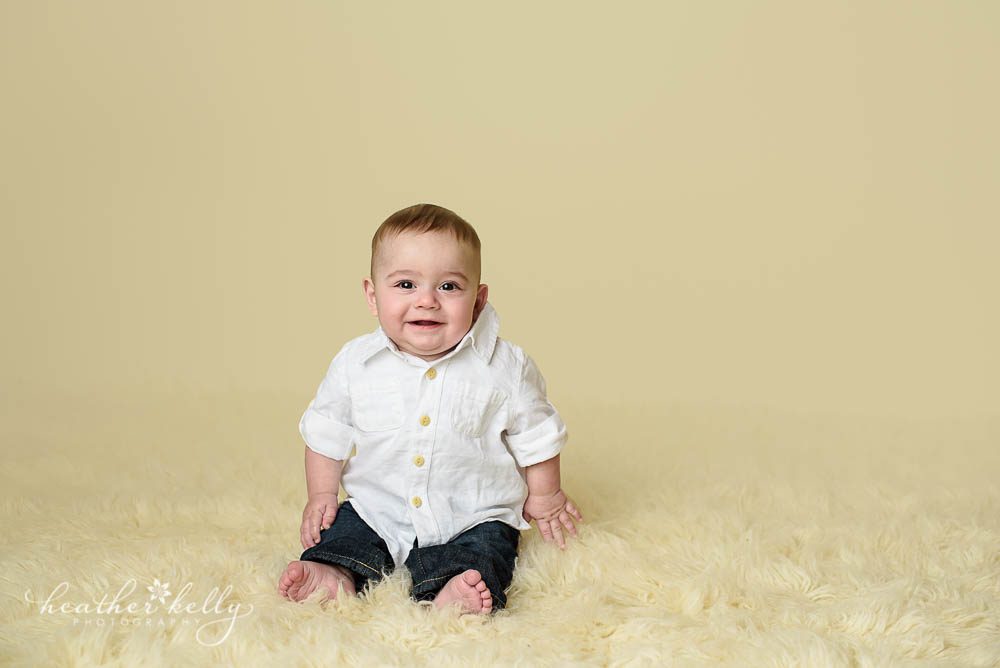 sitting baby boy during 6 month milestone session