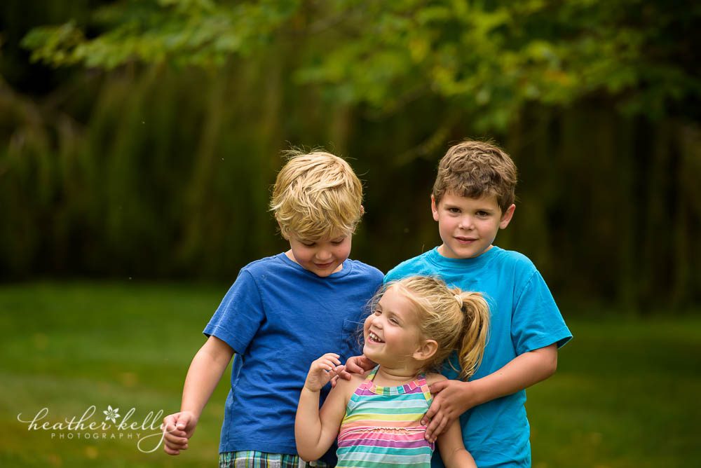 outtake of three siblings in newtown park