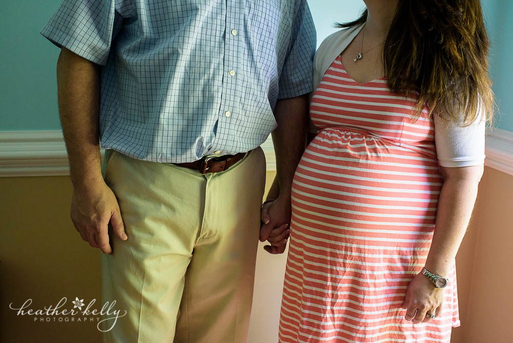 maternity image with mom and dad holding hands