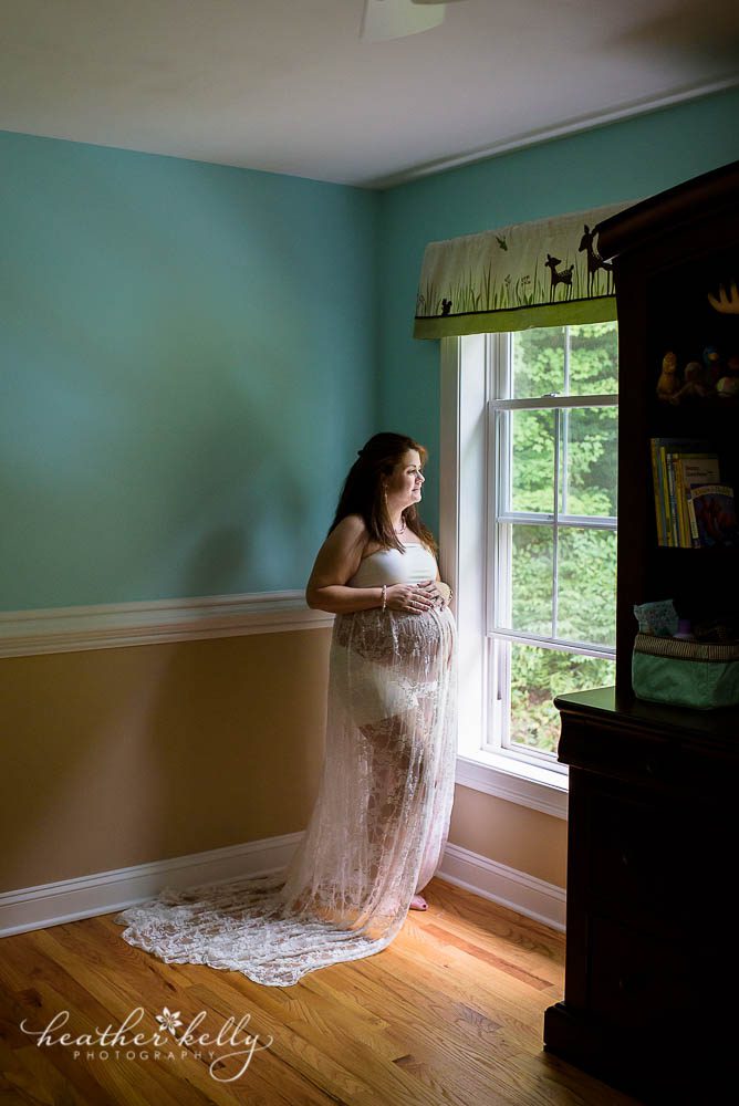 maternity photography in baby's nursery