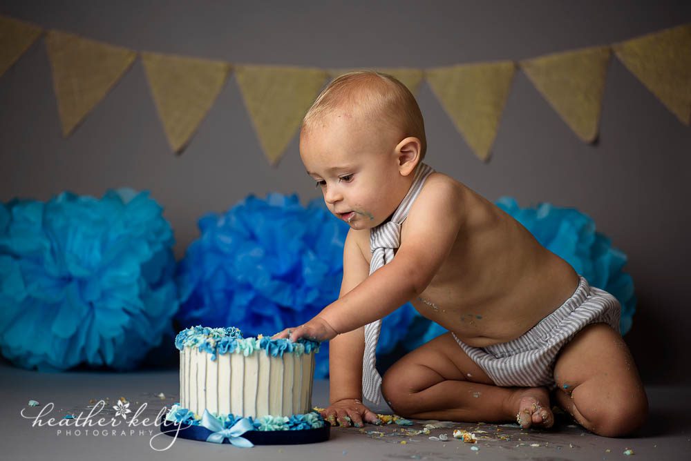 one year old and his cake for first birthday