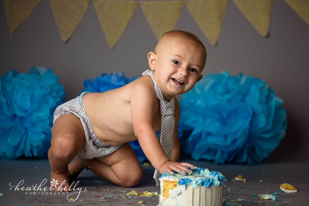 happy one year old boy during cake smash
