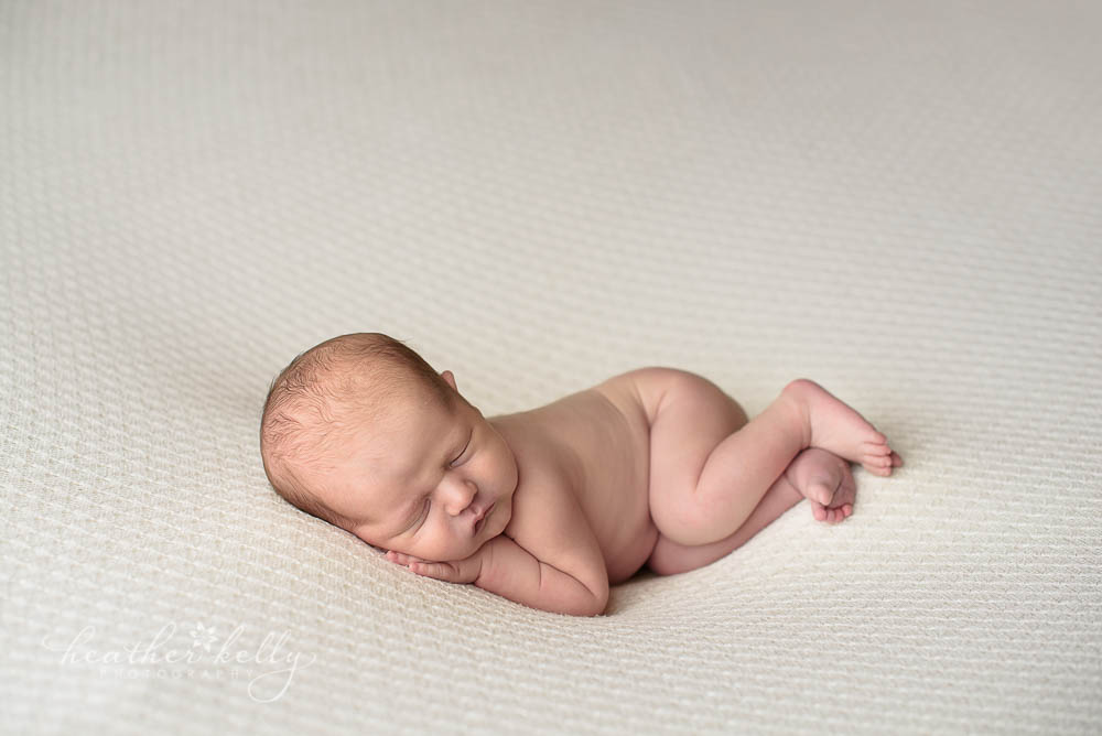 newborn boy side lying pose