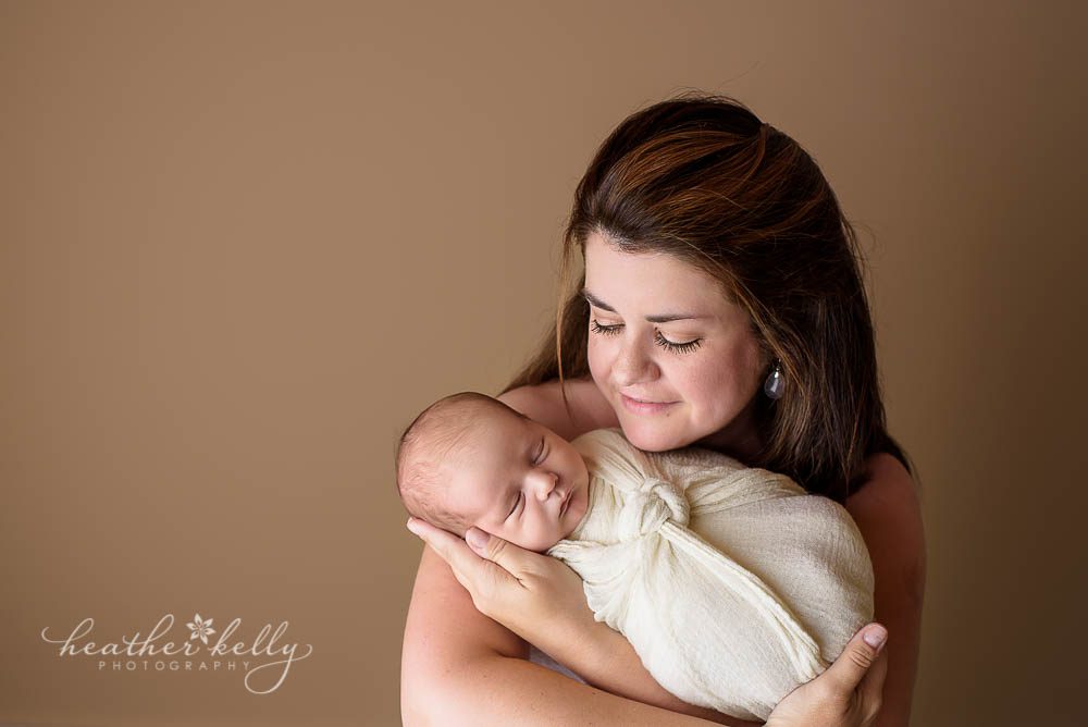 mom hold newborn boy