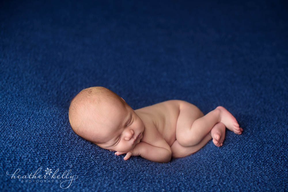 newborn photography side laying newborn boy