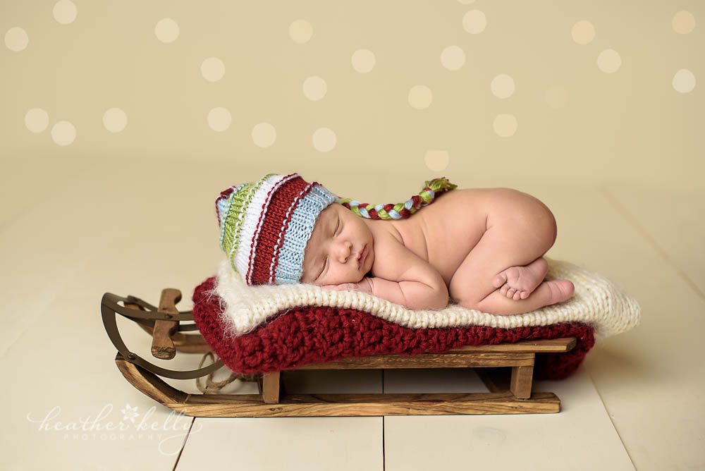 trumbull ct adorable Christmas themed newborn on a sled photo