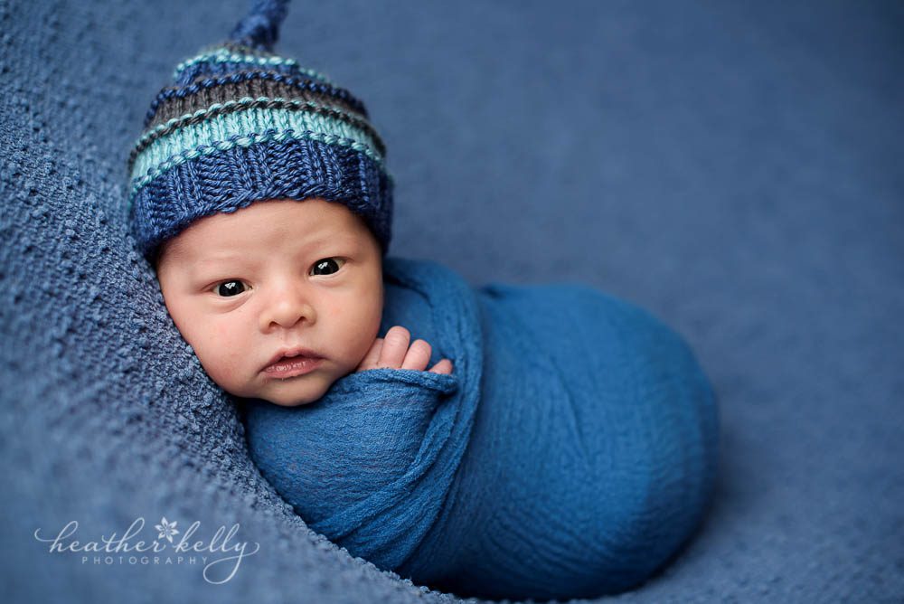 awake newborn boy wrapped in blue photo trumbull ct