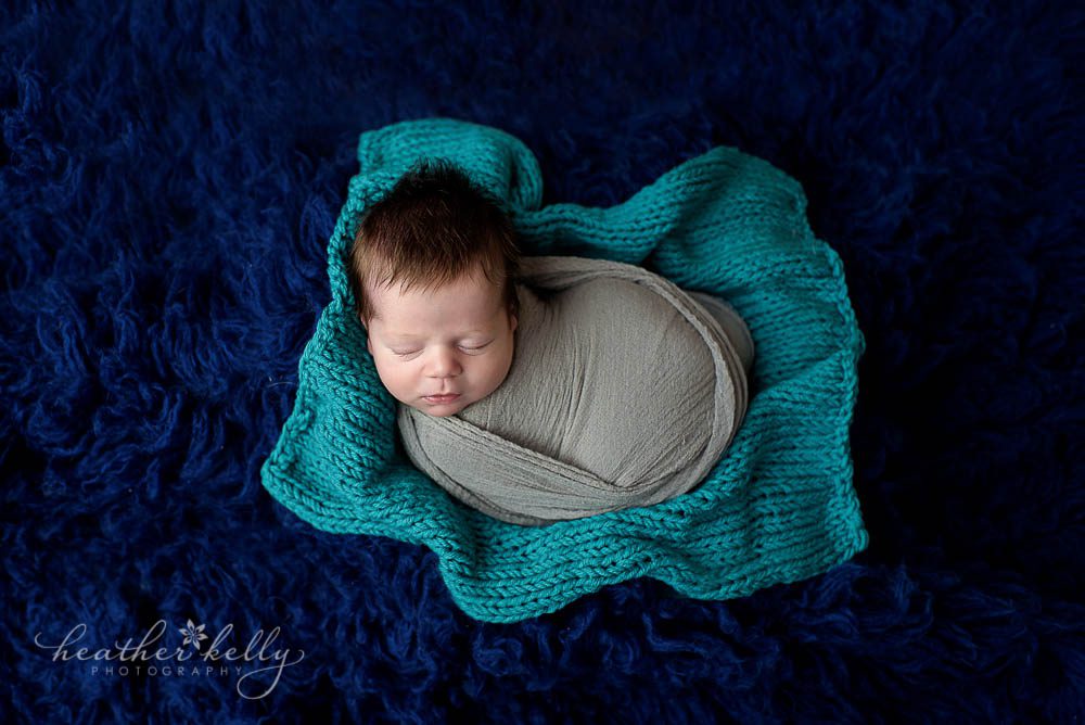 newborn photography photo with baby boy wrapped, navy, gray, teal