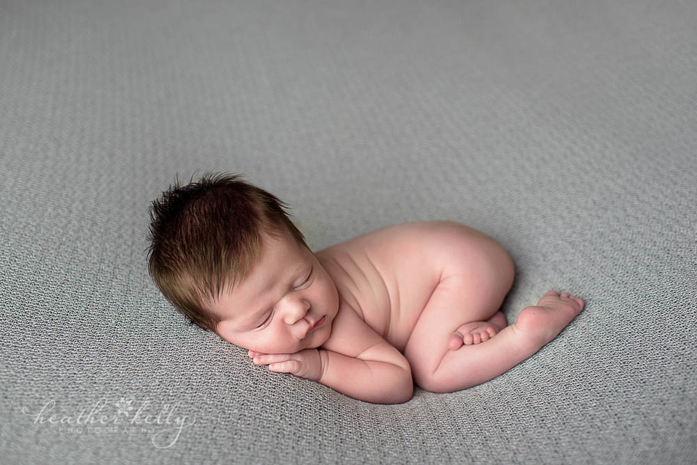 adorable newborn boy on gray blanket shelton newborn photos