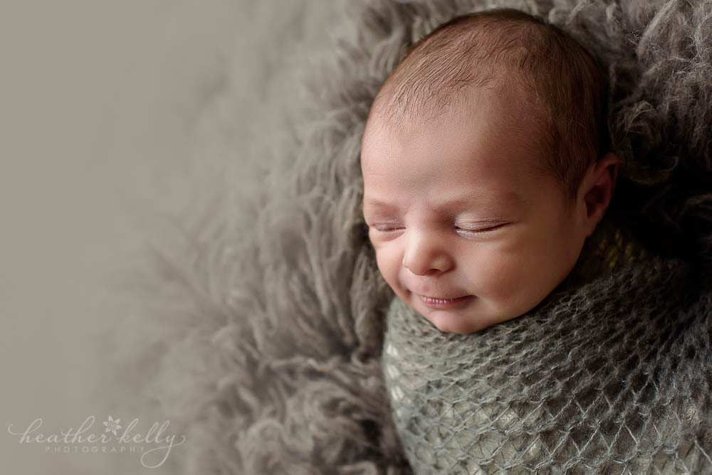 newborn boy wrapped in gray norwalk newborn photography ct