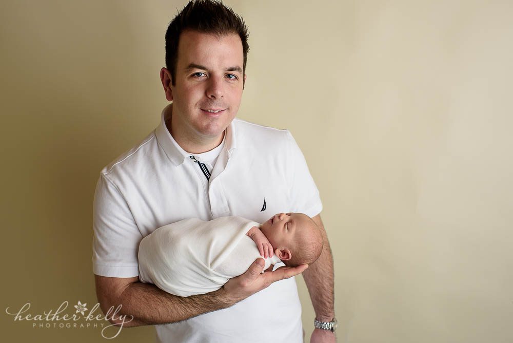 dad holding newborn baby photo adorable monroe newborn