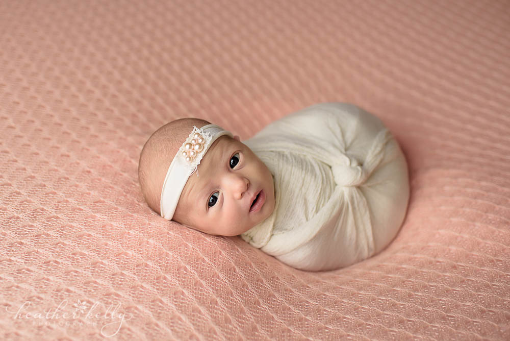 White awake newborn photography. Peach and white. Love! Adorable Monroe newborn. 