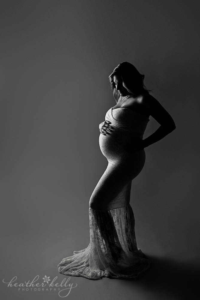 image of pregnant mama with low light and sew trendy gown fairfield county pregnancy photos