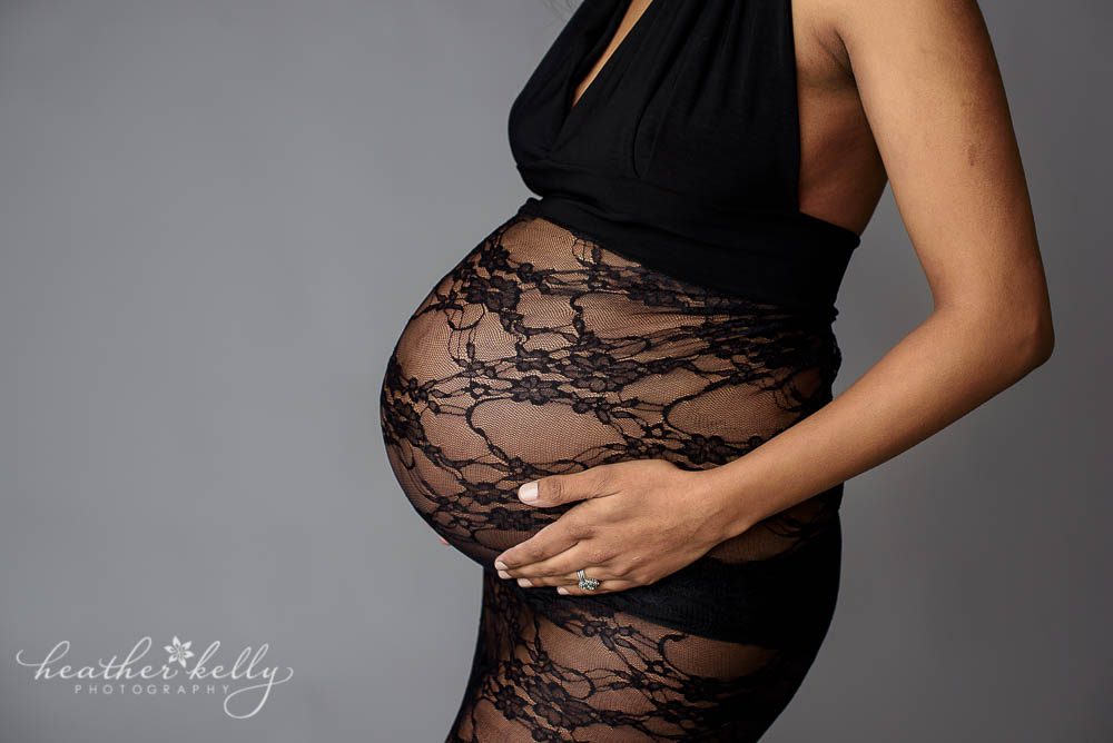 maternity photos close up of belly in black lace gown