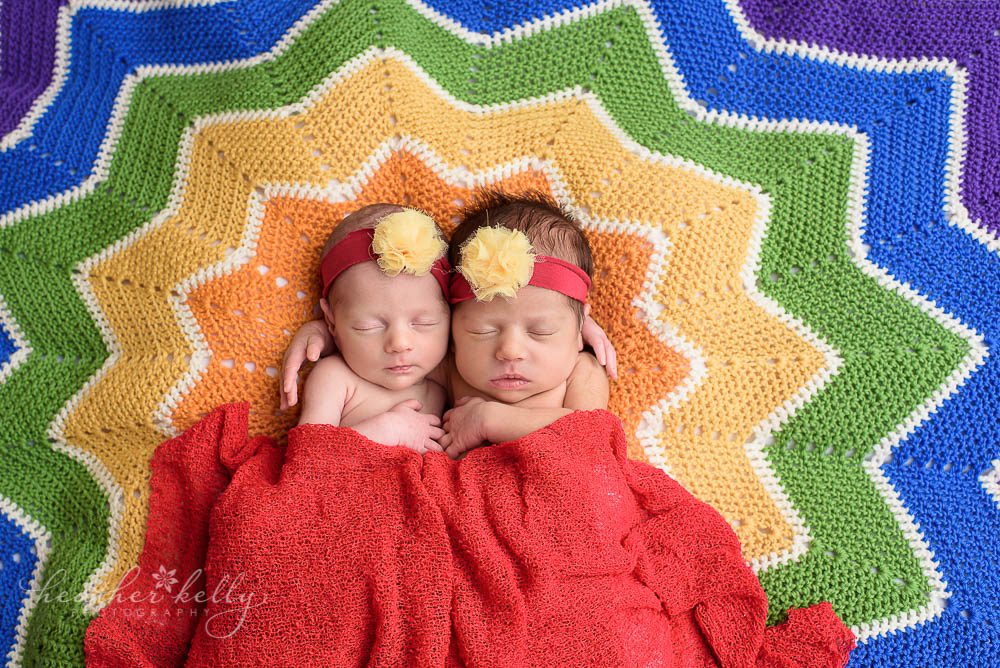 twin newborns on gorgeous rainbow blanket made by mom. newtown ct twins. 
