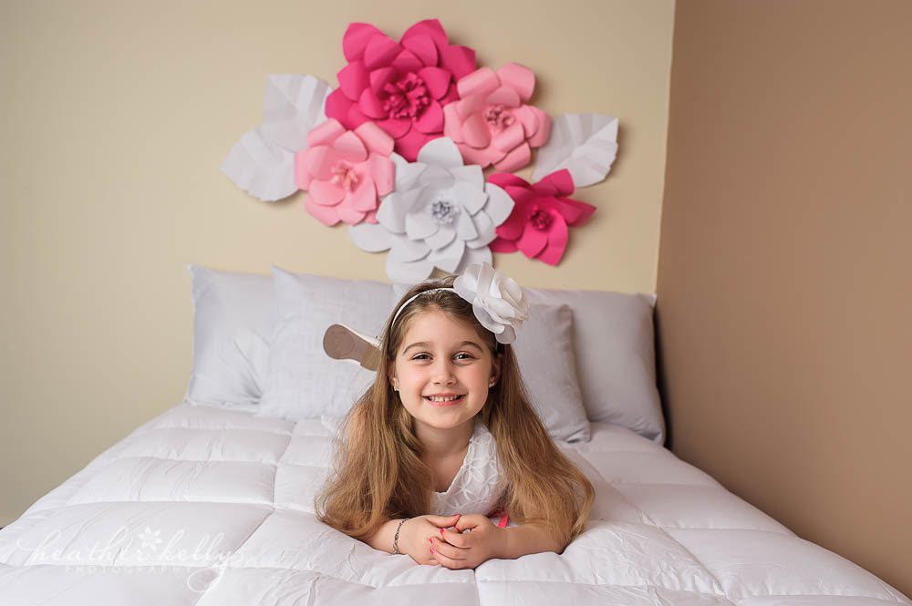 ct child photographer | girl on bed photo with paper flowers | newtown newborn photos