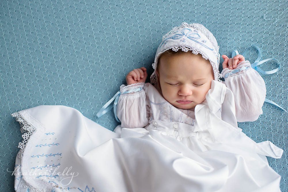 Baby girl sleeping in Baptism gown on blue. CT baptism photos. 