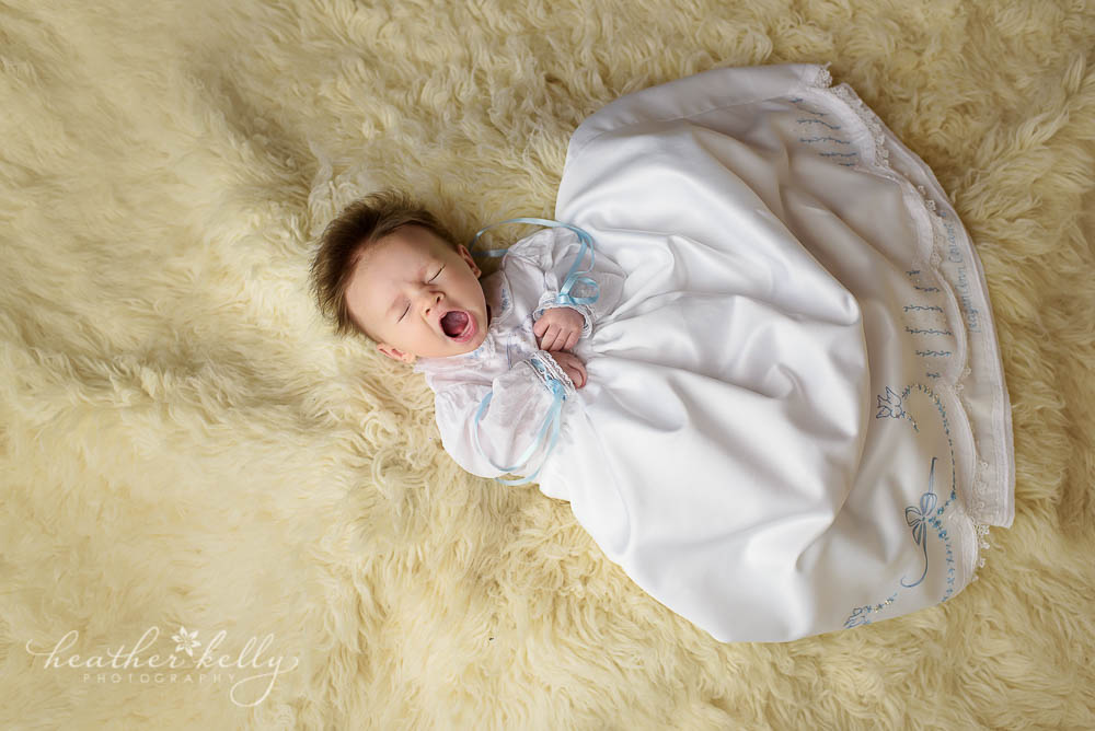 yawning 6 week old girl in baptism gown. CT baptism photos. 