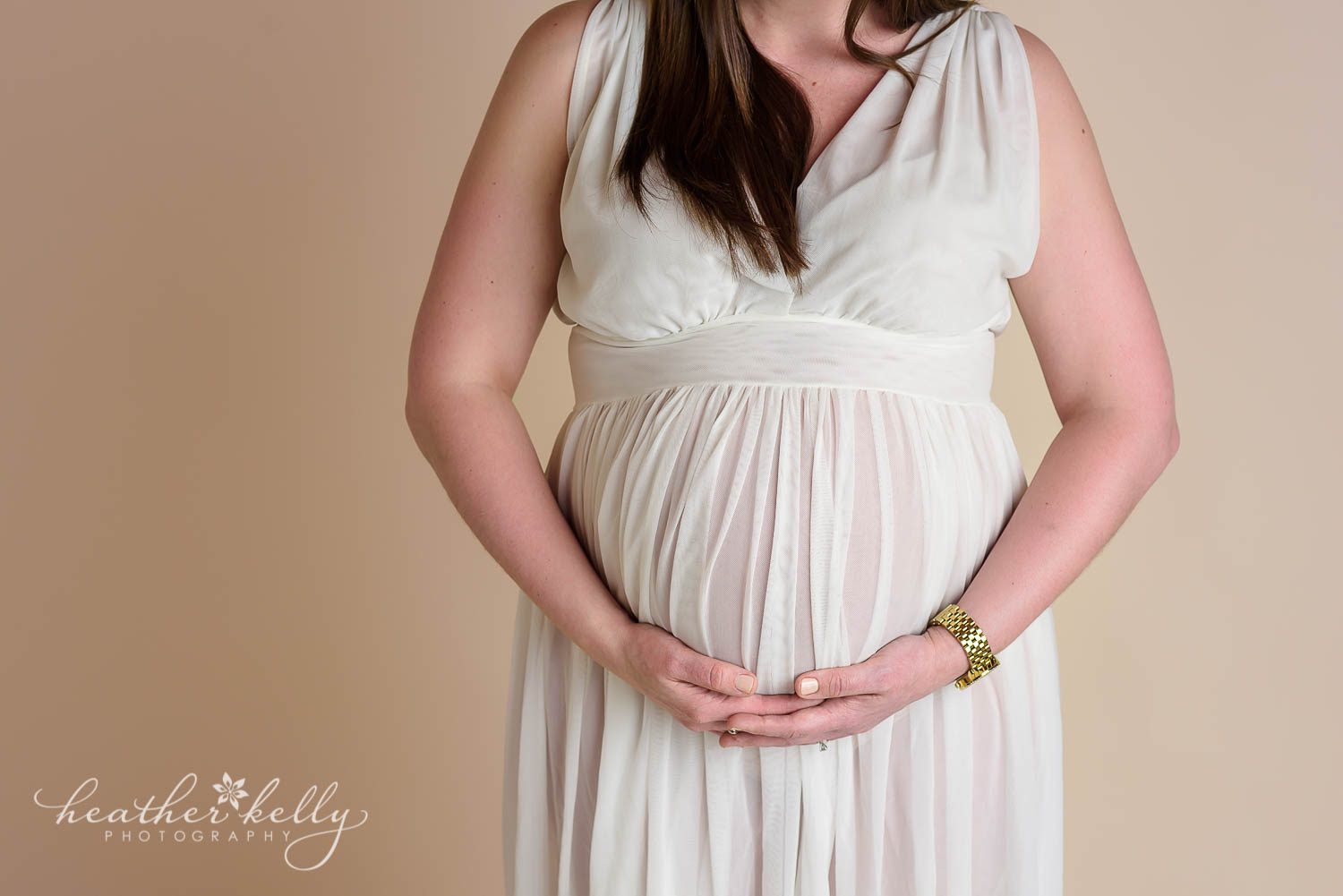 maternity photography close up of belly in sheer gown