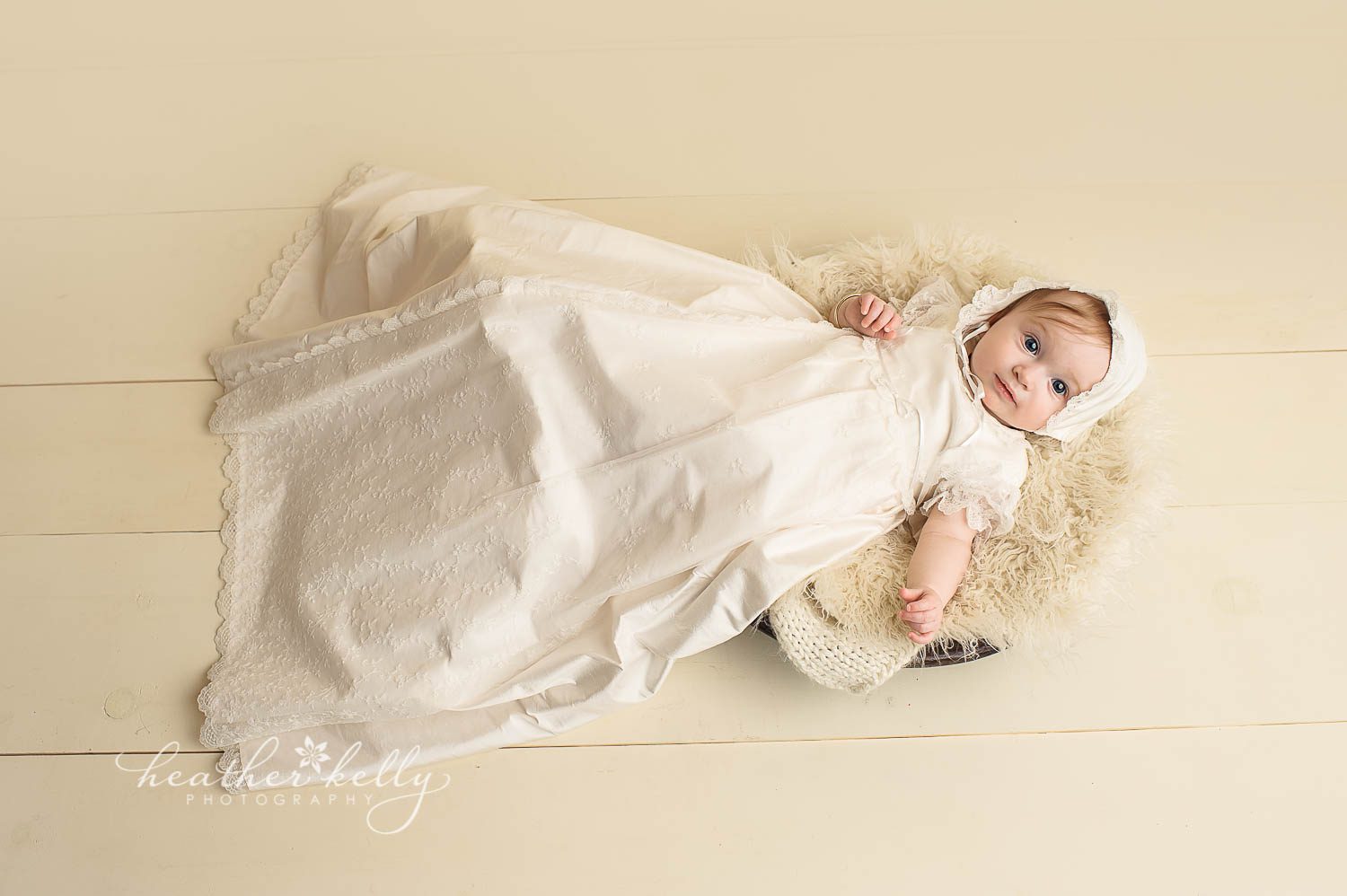 full body image of baby girl in white baptism gown photo. Baptism portrait photography by ct baby photographer heather kelly photography