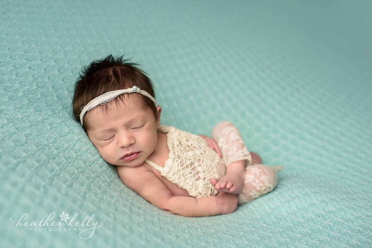 newborn photography photo. Baby girl in cream lace outfit on back. monroe ct newborn photography