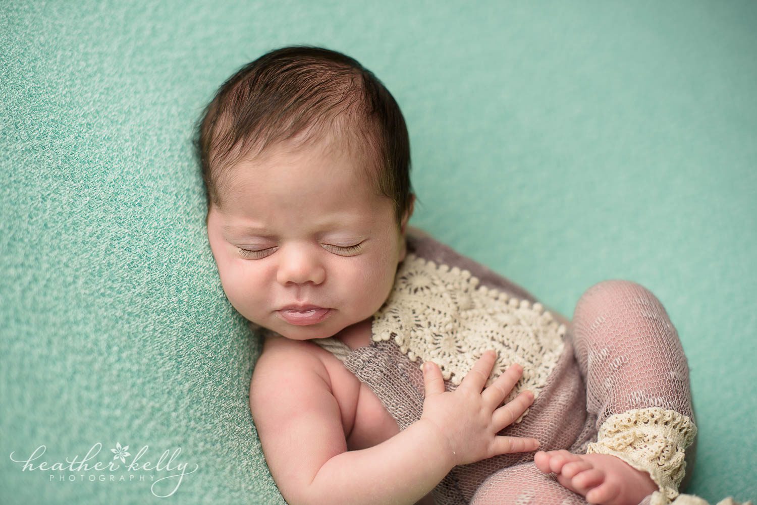 mint and purple newborn photography of baby girl on back. Weston ct newborn photography