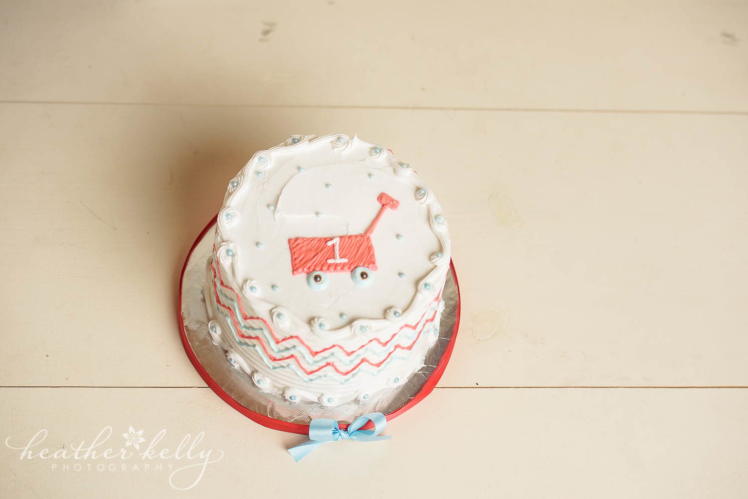 little red wagon cake smash. photo of cake complete with a little red wagon on top