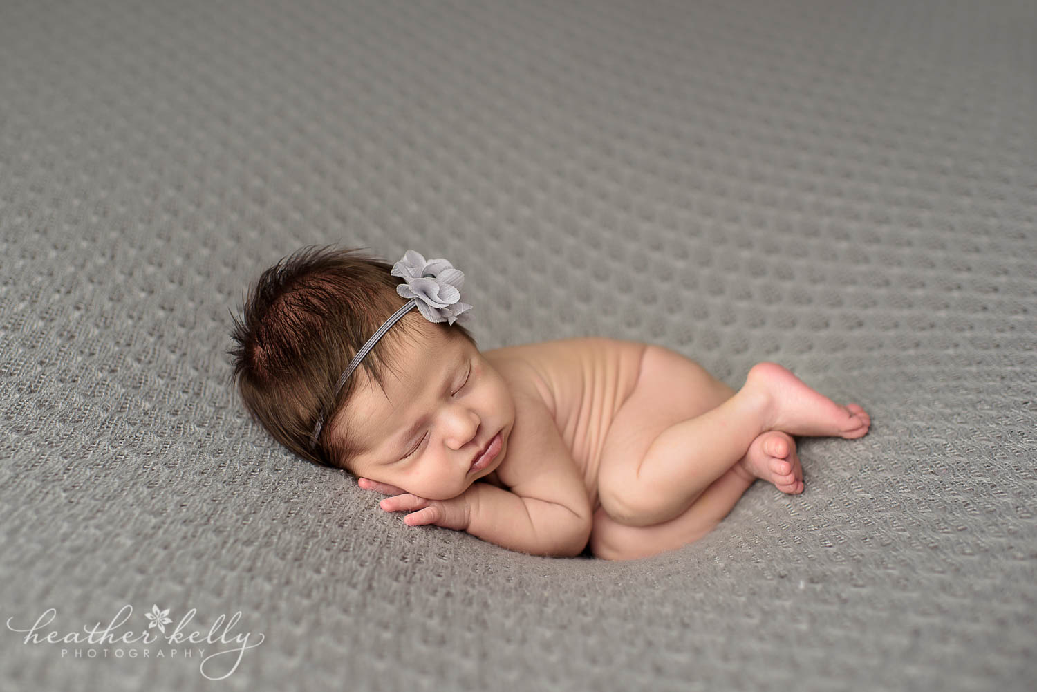 newborn photography poses baby girl gray