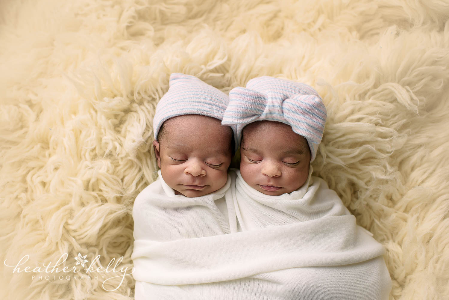 twin newborn photography east hartford. twins wearing hats from hospital