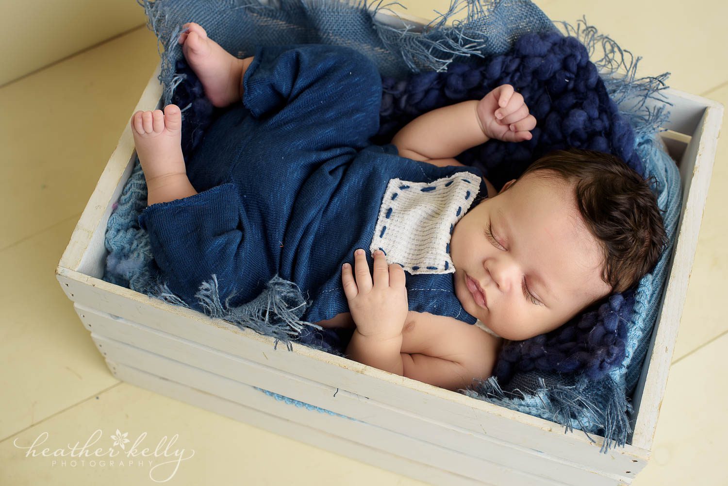asleep baby boy in crate during danbury newborn portraits