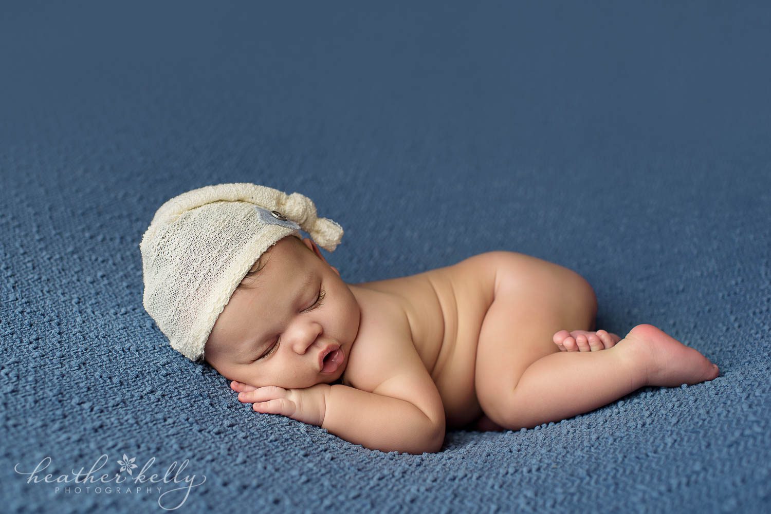 sleepy cap on newborn boy during danbury newborn portraits