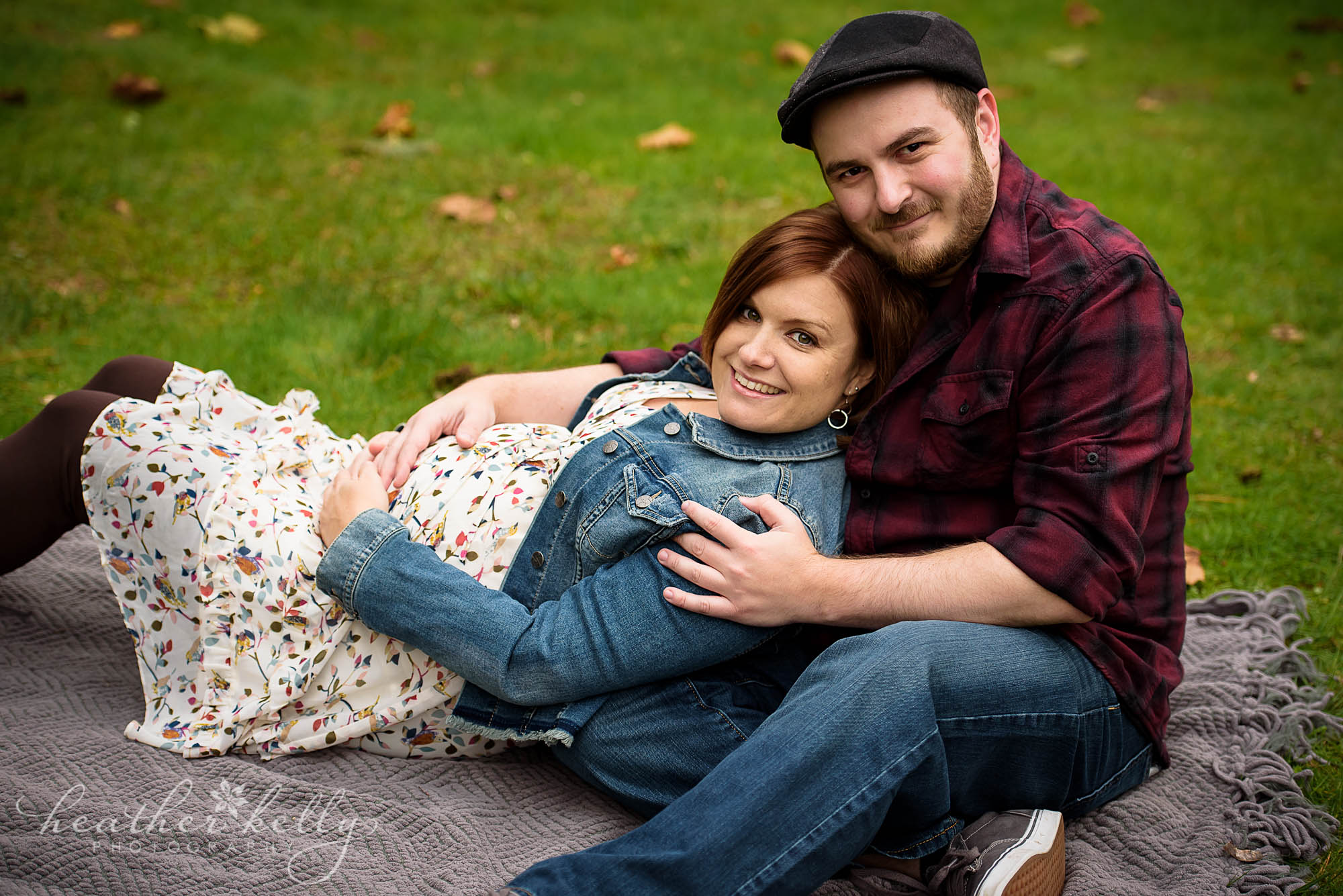 mom laying on dad maternity. new milford maternity family photography
