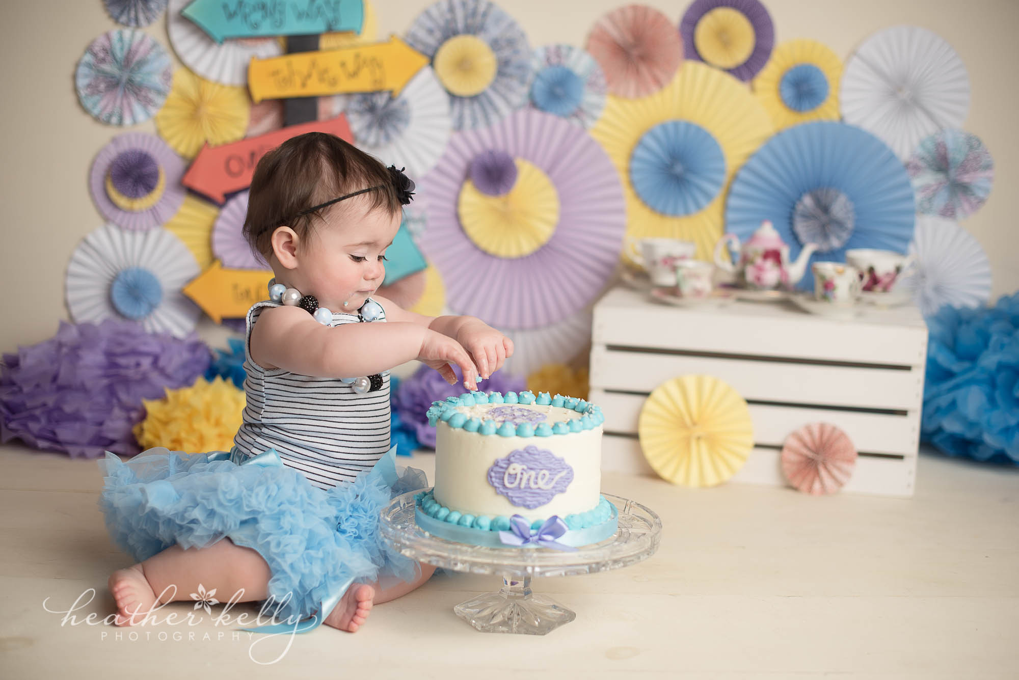 purple and blue alice in onederland cake smash. weston ct baby photography