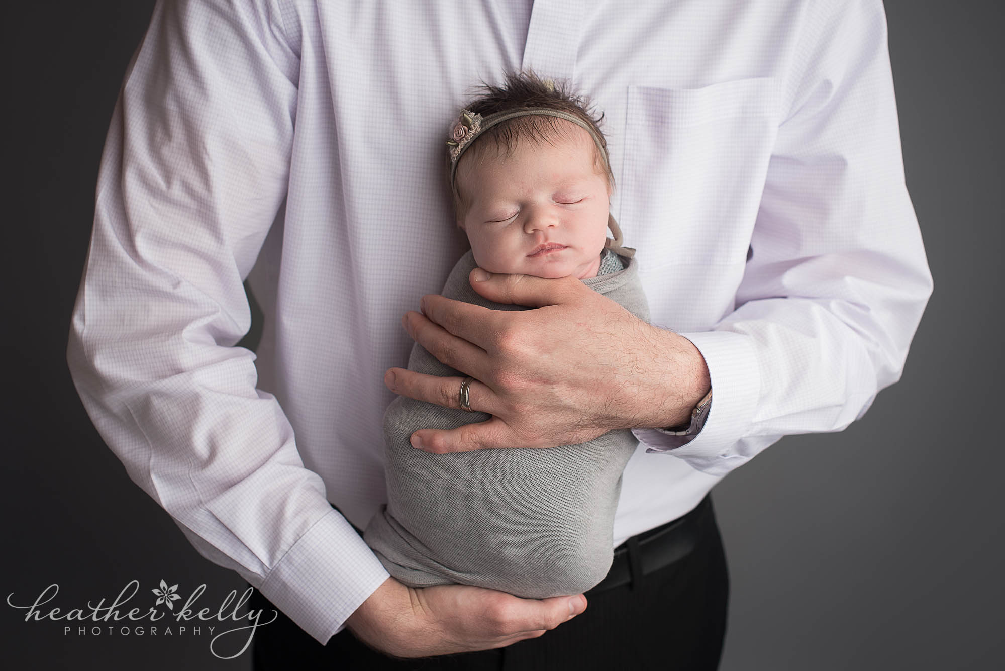 dad holding newborn girl. plainville ct