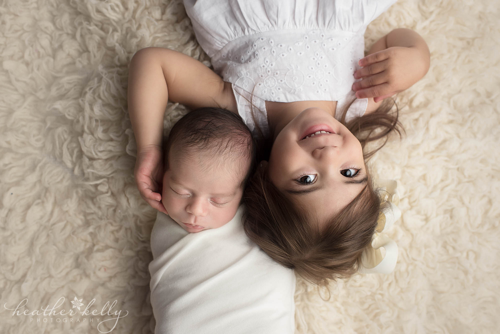 sister and newborn brother. sweet baby boy newborn photography