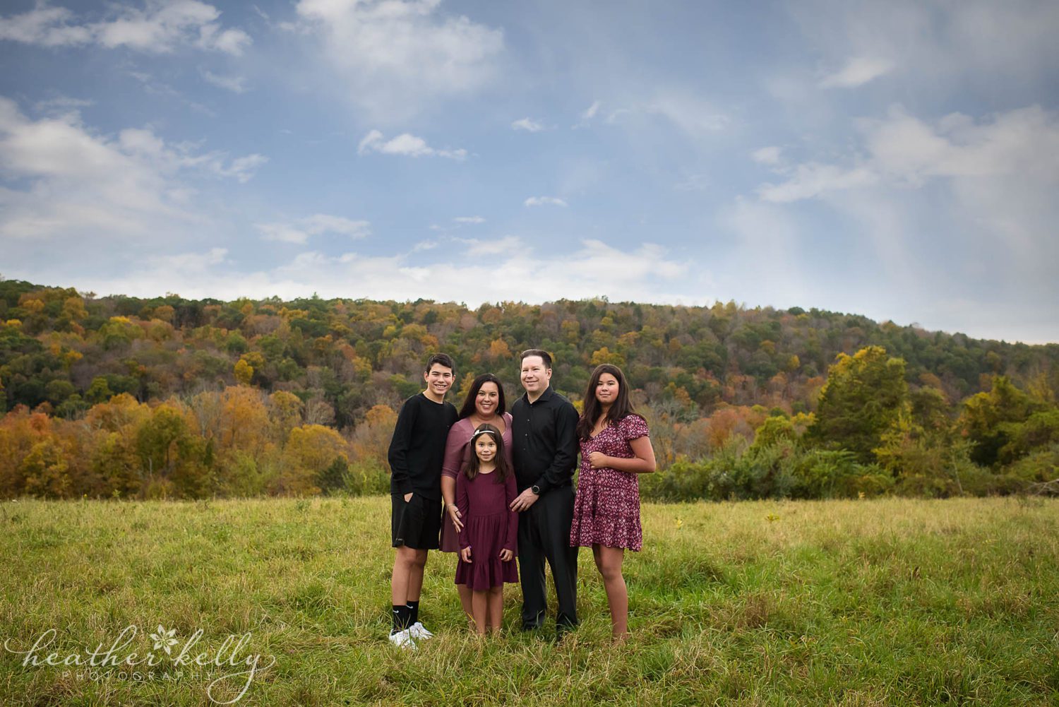 family of five posing for their family portraits at Aquila's Nest Vineyard in Sandy Hook, CT 