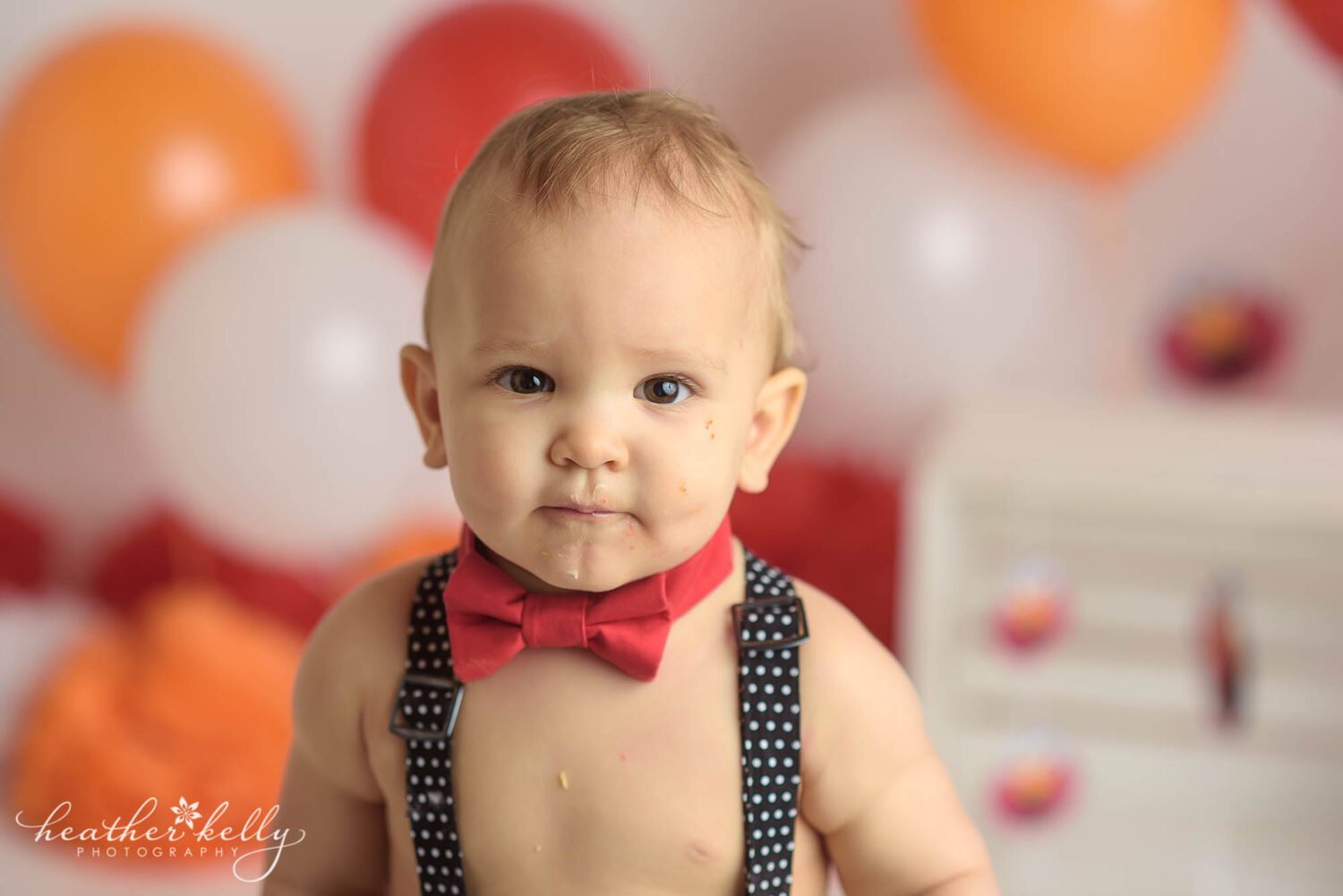 portrait of a one year old boy for his Stratford CT cake smash photography session by Heather Kelly Photography