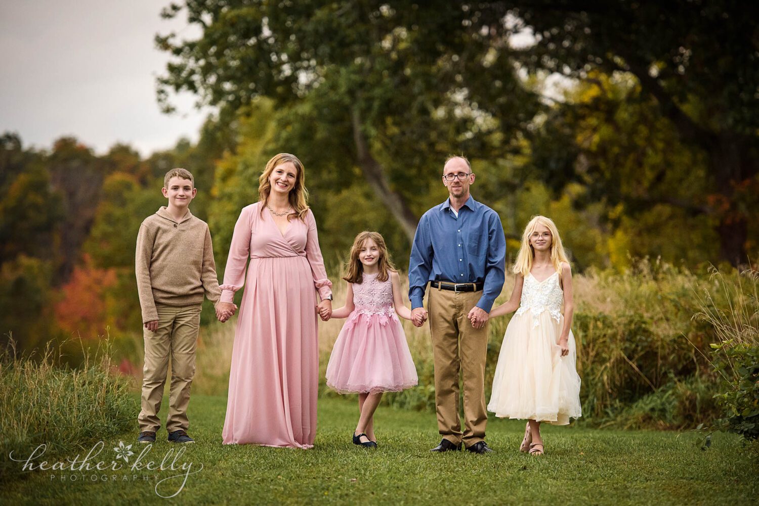 newtown area family photography. Family of 5 all holding hands and looking at the camera. 