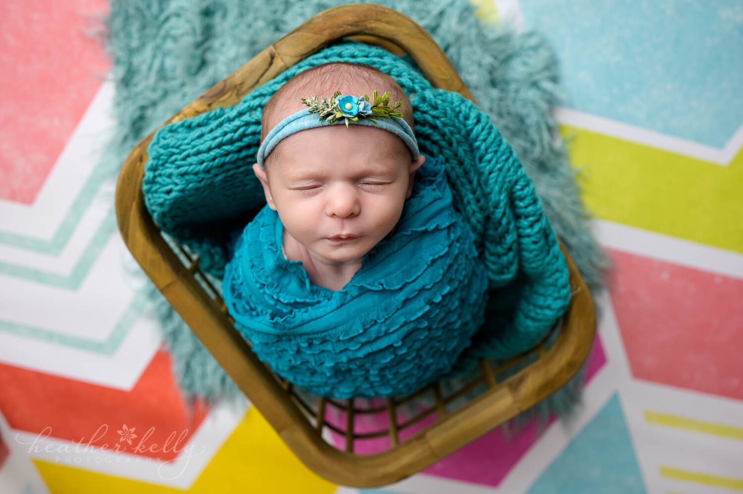 a CT newborn photography session with a baby girl in a crate. 