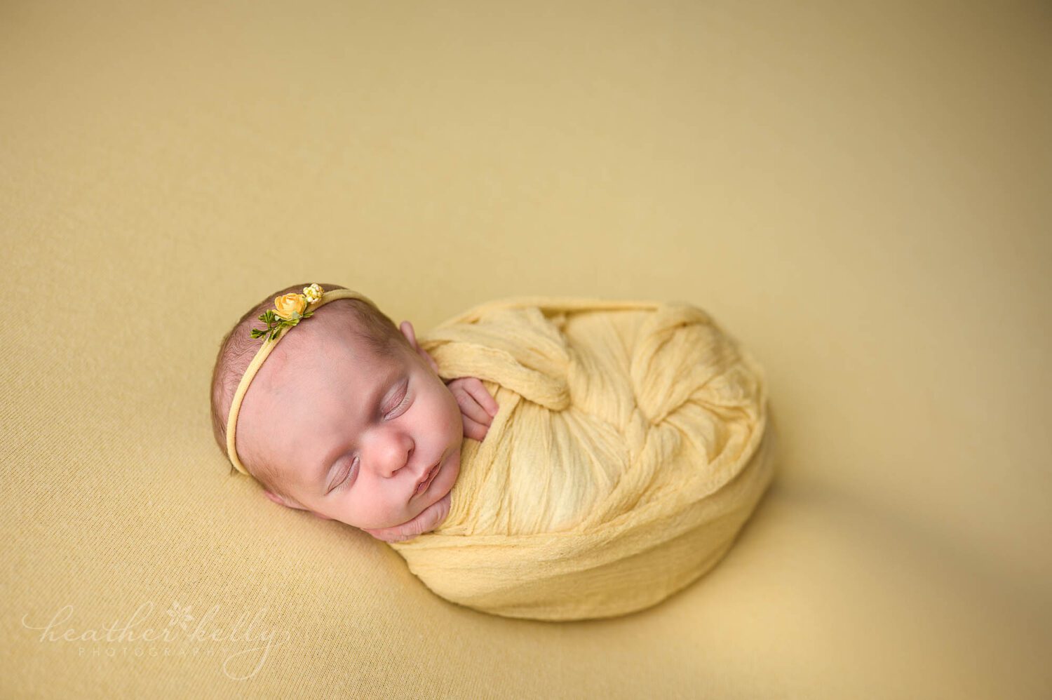 wrapped in yellow, this baby girl rocked her newborn photography session in CT 