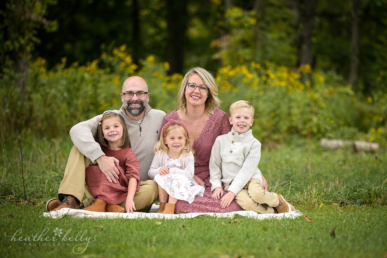 a family of 5 poses together during their outdoor ct photography session
